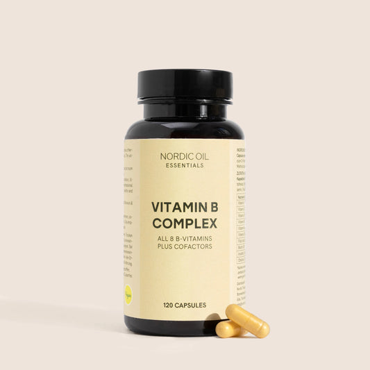 Integratore Vitamin B Complex in bottiglia scura con capsule gialle